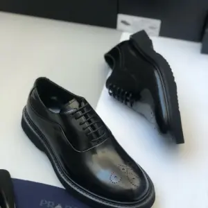 Black leather derby shoes, brogue toe detail