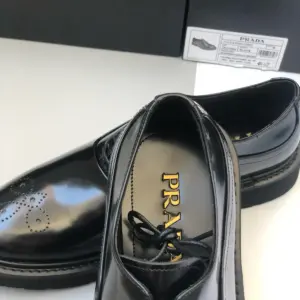 Black leather derby shoes, side view